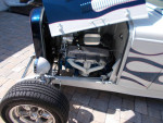 Close-up of a 1932 Ford Roadster Hi Boy engine, showcasing its chrome details and V8 configuration.