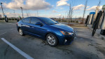 2019 Hyundai Elantra SEL parked, showcasing clean lines and modern features at a charging station.