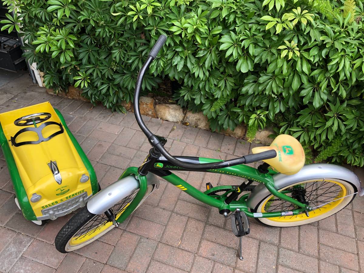Gearbox John Deere pedal car (315) and a 20” nirve John Deere bike ($1