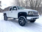 Chevrolet Silverado truck in snow, showcasing its modifications and unique design in excellent condition