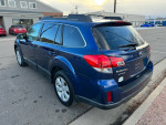 2011 Subaru Outback Premium in blue with clean exterior, parked in a lot, features all-wheel drive and heated seats.
