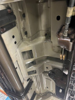 Undercarriage view of a rust-free 2001 Ford Excursion showcasing its well-maintained condition.