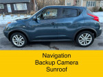 2013 Nissan Juke SV in gray, featuring navigation, backup camera, and sunroof, parked on street.