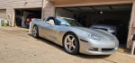 2006 Chevrolet Corvette C6 Z51 with 53k miles, silver, parked in driveway, showcasing its sleek design.