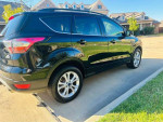 2018 Ford Escape SE FWD in excellent condition, featuring heated seats and backup camera, parked outside.