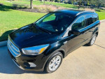 2018 Ford Escape SE in excellent condition, featuring heated seats and a backup camera, parked outdoors.