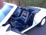 Interior of a Ford convertible with leather seats and a sleek design, ideal for classic car enthusiasts.