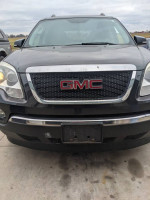 Front view of a 2012 GMC Acadia SLT with a rust-free exterior, showcasing its brand new motor and stylish design.