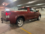 2008 Toyota Tundra 4WD truck with X-SP package in parking garage, showing some exterior wear and tear
