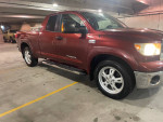 2008 Toyota Tundra 4x4 in a parking garage with a maroon exterior and chrome accents