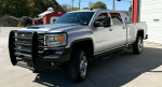 Silver GMC Sierra truck with 6.6L Duramax Diesel engine and Z71 4x4 package parked outdoors.