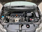 Honda Civic engine compartment showcasing clean and well-maintained components with no issues.