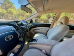 Interior view of 2005 Toyota Prius with gray upholstery and dashboard, highlighting spacious cabin features.