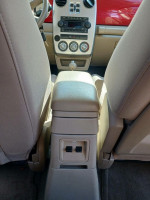 Interior view of the 2006 Chrysler PT Cruiser showcasing the center console and gray upholstery.