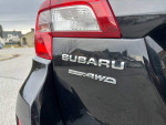 Close-up of the rear badge of a 2017 Subaru Outback 2.5i highlighting its AWD feature.