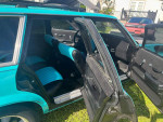 Interior view of a 1978 Chevrolet Malibu Custom Wagon with teal and black seating