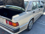 1987 Mercedes-Benz 190E Cosworth with rear trunk open, showcasing the car's solid body and well-maintained condition.