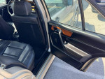 Interior view of a 1994 Mercedes-Benz E-Class E320 showing leather seats and door panel details.