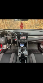 Interior view of a 2017 Honda Civic EX with clean title and low mileage, ready for sale.