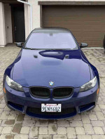2008 BMW M3 coupe in Interlagos Blue Metallic with black roof and clean front view