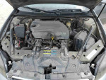 Engine view of a 2006 Chevrolet Impala LS with 3.5L V6, clean and reliable car for budget-friendly commuting.
