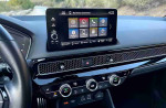 Interior dashboard of a 2024 Honda Civic Sport with infotainment display and climate controls.
