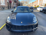 Front view of a 2015 Porsche Macan S AWD in excellent condition, showcasing its sleek design and headlights.