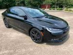 2016 Chrysler 200S with black exterior, panoramic roof, and blue leather interior, parked outdoors.