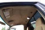 Interior view of the 2005 Ford F-250 Super Duty XLT showing headliner and sun visors.