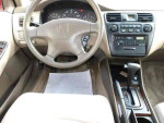 Interior view of a used 2000 Honda Accord SE with automatic transmission and beige seats