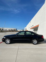2004 Mercedes-Benz E320 in excellent condition with 69,727 original miles, parked outside in bright daylight.