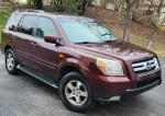 2007 Honda Pilot EX FWD in maroon color, showcasing 132,000 miles and various features like navigation and leather seats.