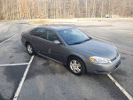 2009 Chevrolet Impala LS in excellent condition with low mileage, parked in a clean outdoor setting.