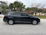 2010 Lincoln MKT in black with low mileage, featuring a panoramic sunroof and third-row seating.