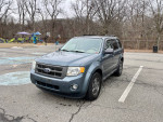 2011 Ford Escape XLT FWD parked in a playground area, featuring new all-season tires and sunroof.