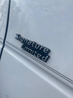 Close-up of the Signature Limited emblem on a 2006 Lincoln Town Car