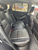 Interior view of 2014 Acura RDX showing spacious back seats with leather upholstery.
