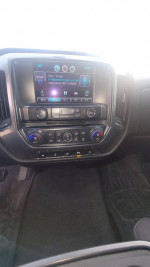 Interior view of 2015 Chevrolet Silverado 1500 LT with touchscreen and climate controls