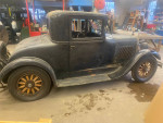 1928 Dodge Brothers sedan with original features, stored since 1959, showcasing vintage design and restoration.