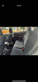 Interior of a 4WD Subaru Impreza hatchback with clean back seats, ready for sale.
