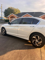 Side view of a 2016 Honda Accord LX in excellent condition on display