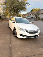 2016 Honda Accord LX FWD parked on the street, showcasing its sleek design and excellent condition.