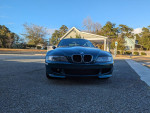 Front view of a 1999 BMW Z3 M Coupe in Boston Green Metallic with Oregon Beige leather interior