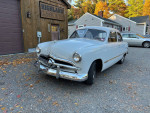 1949 Ford Custom sedan with flathead V8 engine, showcasing excellent condition and classic design.