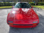 Front view of a well-maintained 1988 Mazda RX7 convertible in red color.