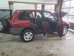 Red RAV4 with open doors, low mileage, in good condition, ready for sale by motivated seller.