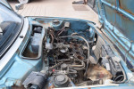 1978 Honda Civic engine bay showing disassembled engine and surface rust on body.