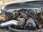 Engine compartment of a 2003 Chevrolet 1500HD crew cab, showcasing refreshed components and upgrades.
