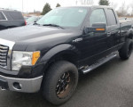 2011 Ford F150 XLT 4x4 supercab with low mileage and clean title, black color, parked on asphalt.