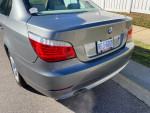 2008 BMW 528i rear view with stylish tail lights, showcasing manual transmission and pristine condition.